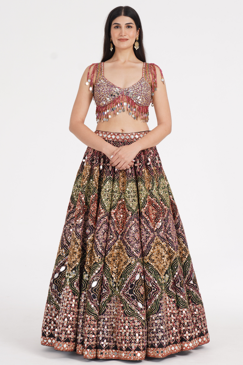 Matte black lehenga embellished using warm pastels